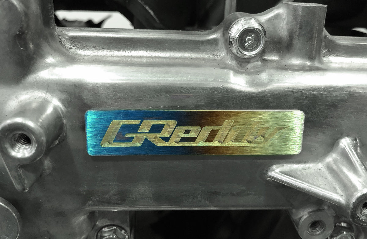 Titanium GReddy Emblem - (70x15mm)